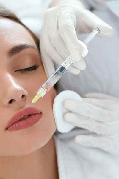 woman having lips injected